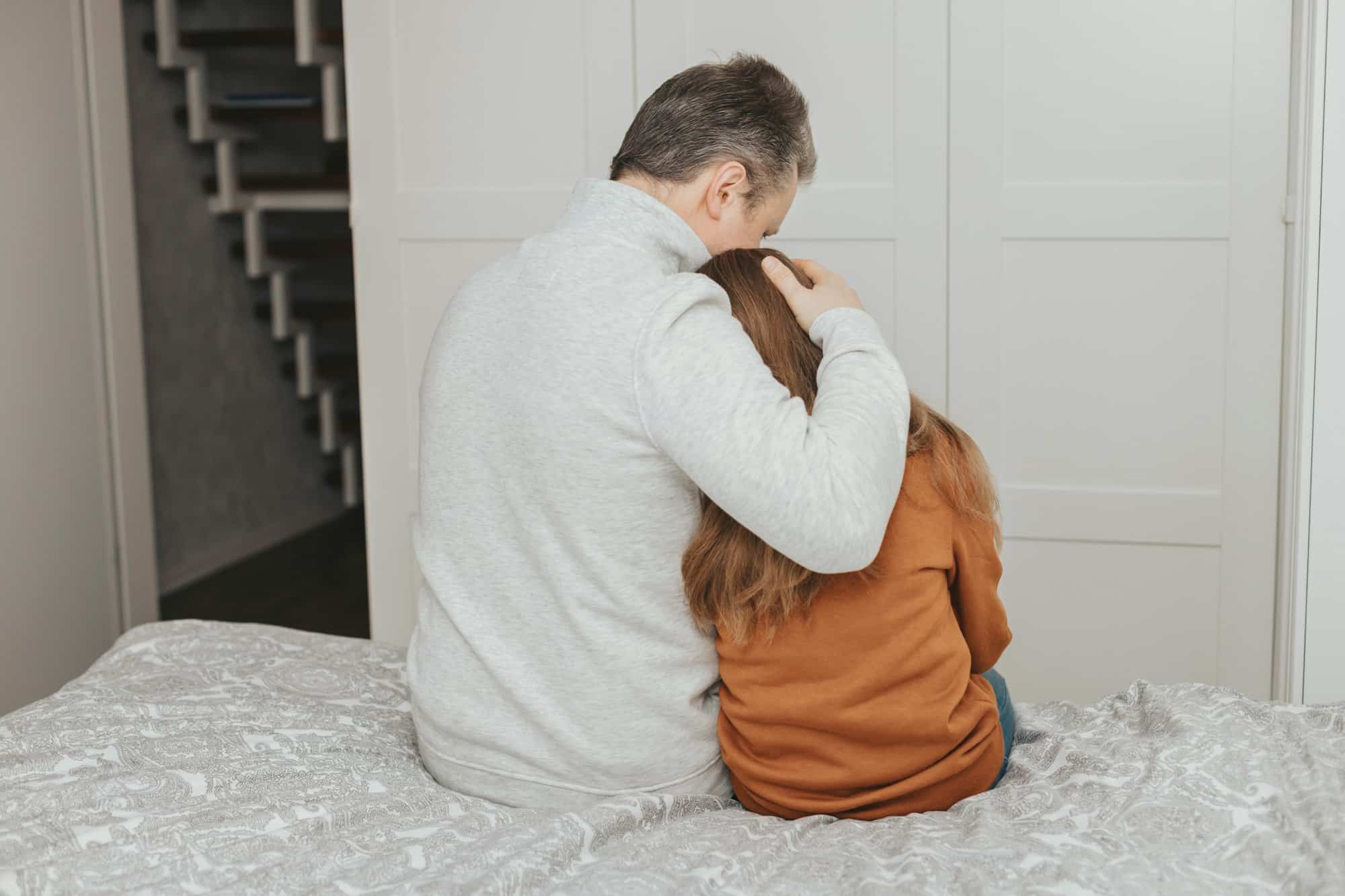 dad comforting or comforting daughter