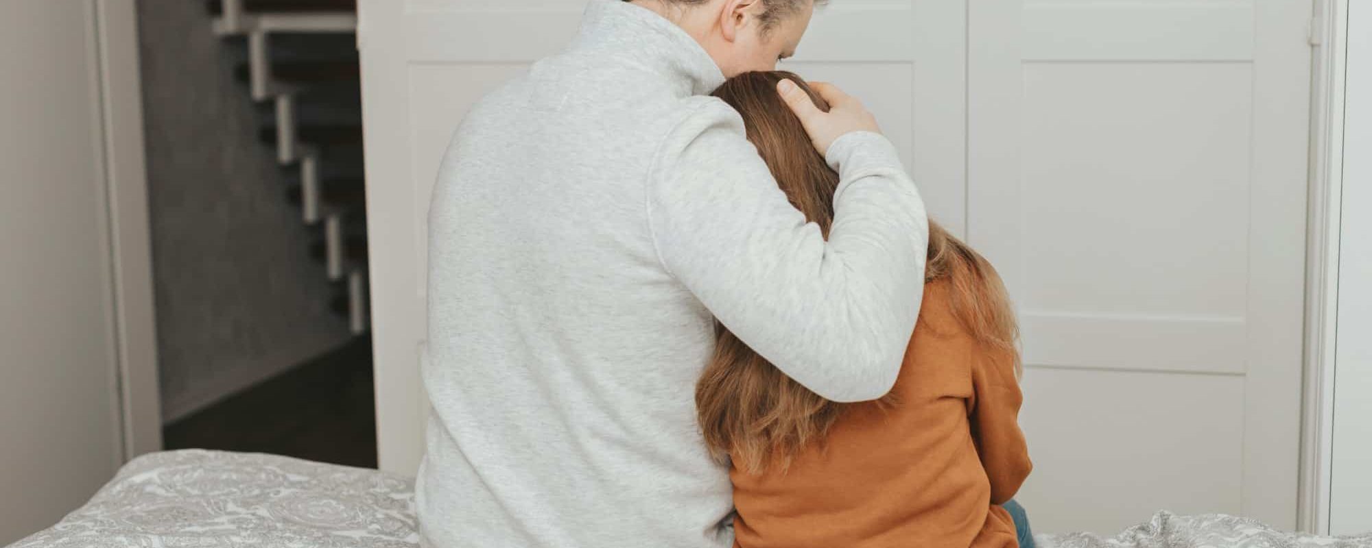 dad comforting or comforting daughter